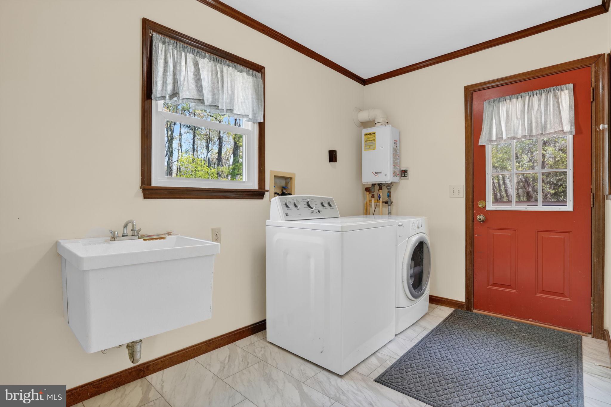 14123 Winterville Road Bloxom, VA 23308 - Photo 19 of 84 a utility room with a sink a washer and dryer