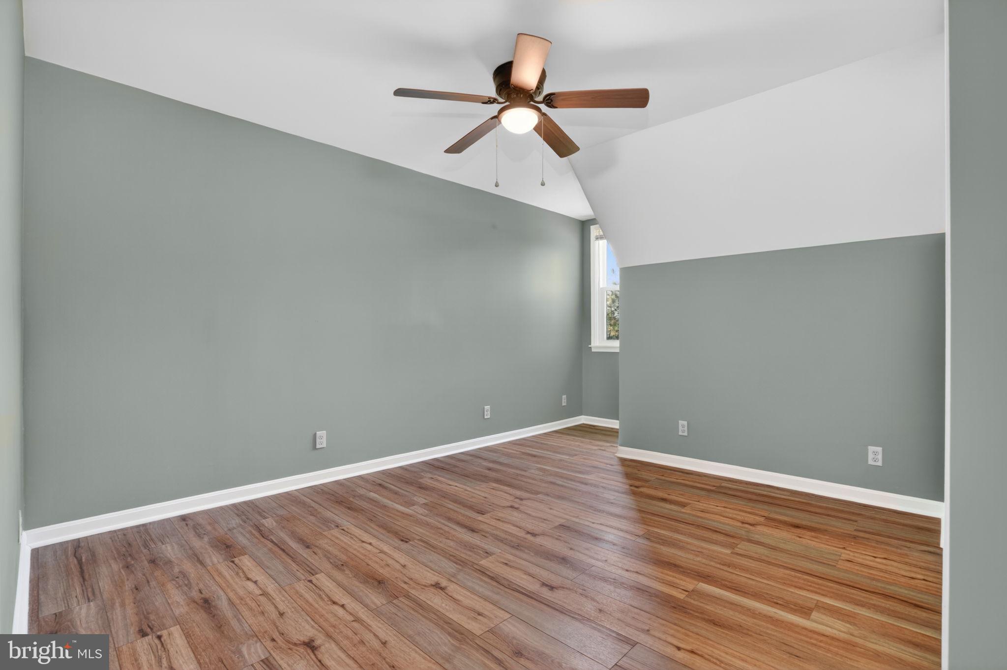 14123 Winterville Road Bloxom, VA 23308 - Photo 28 of 84 a view of room with wooden floor and ceiling fan