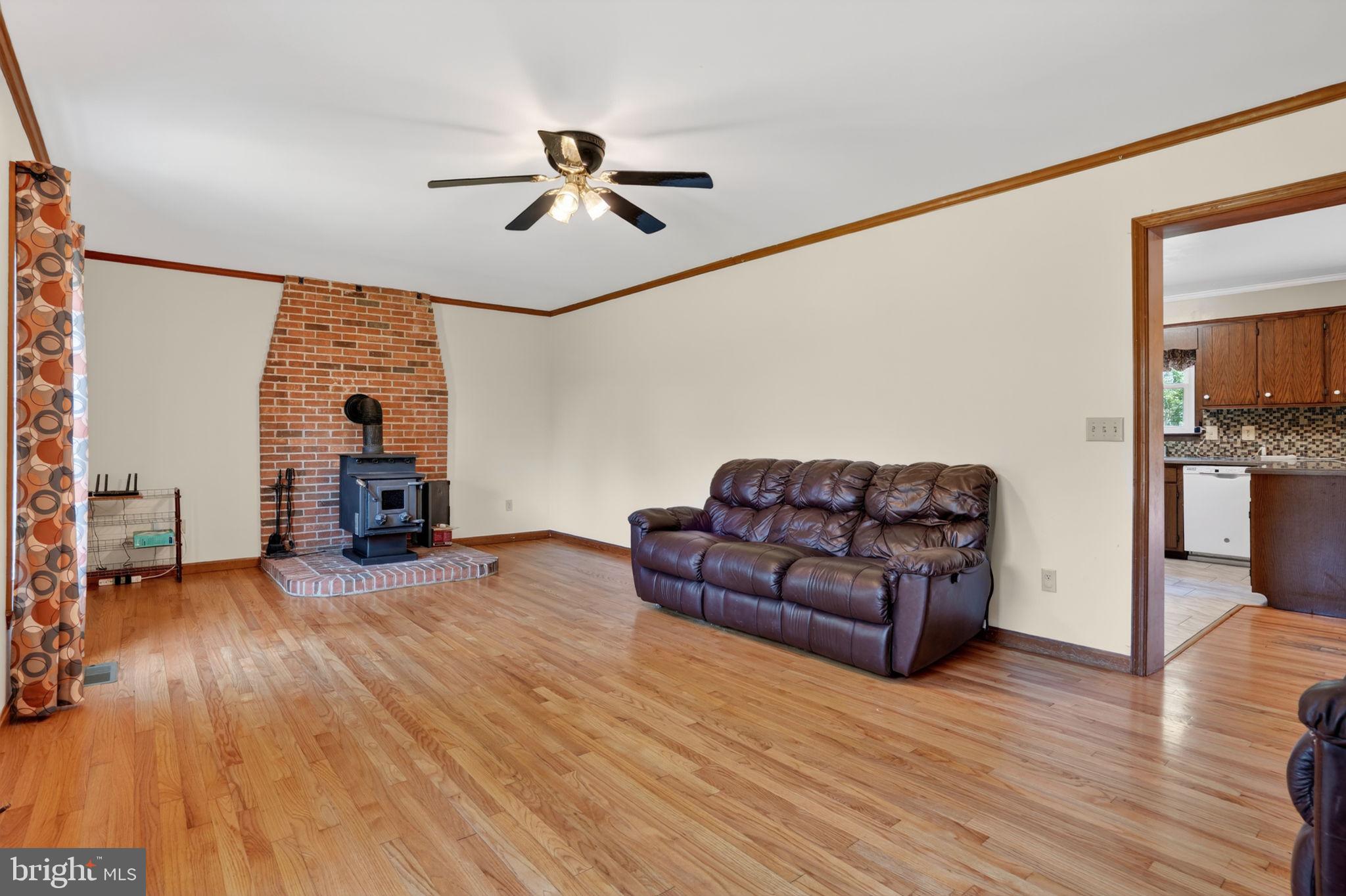 14123 Winterville Road Bloxom, VA 23308 - Photo 3 of 84 a living room with furniture and a fireplace