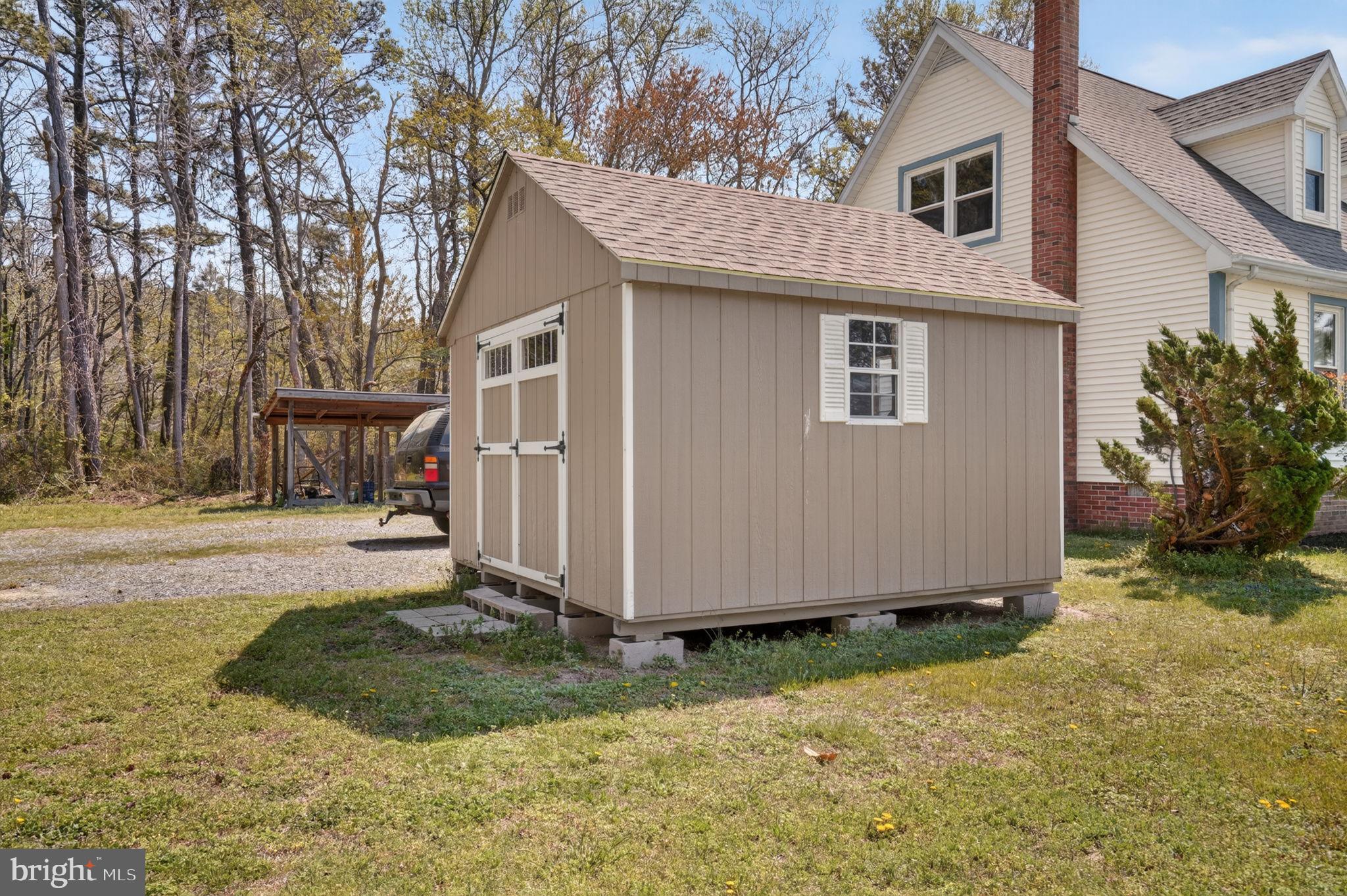 14123 Winterville Road Bloxom, VA 23308 - Photo 44 of 84 a view of a house with a yard