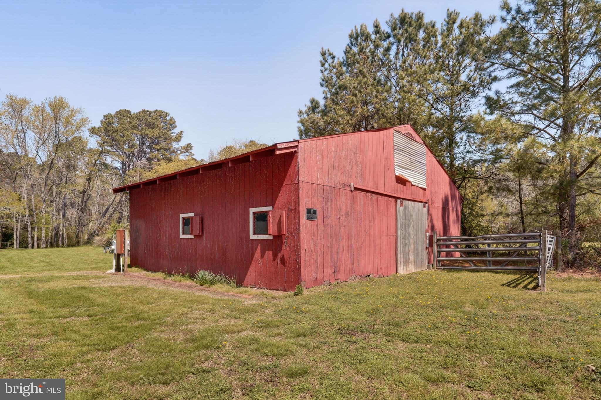 14123 Winterville Road Bloxom, VA 23308 - Photo 54 of 84 a house with trees in front of it