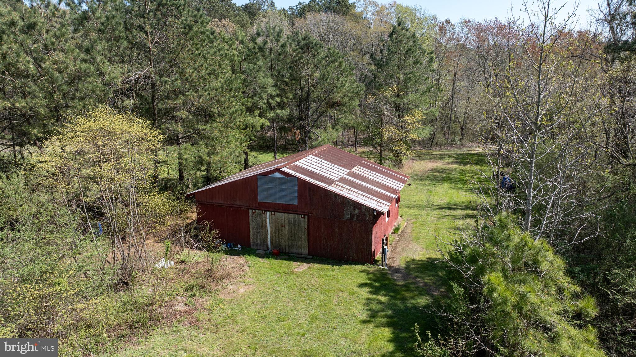 14123 Winterville Road Bloxom, VA 23308 - Photo 78 of 84 a house with trees in the background
