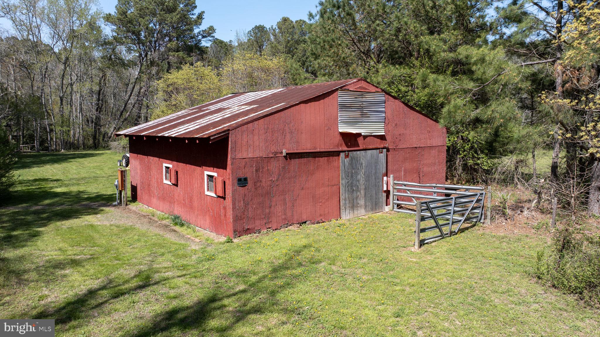 14123 Winterville Road Bloxom, VA 23308 - Photo 79 of 84 a view of a house with a yard