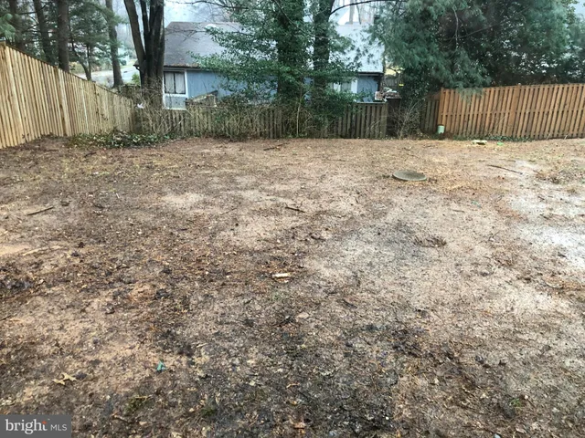 a view of a backyard of the house