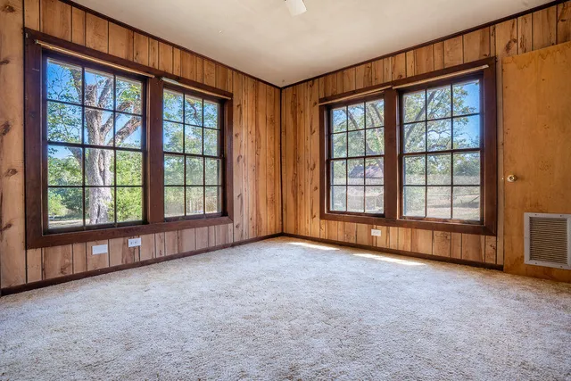 an empty room with windows