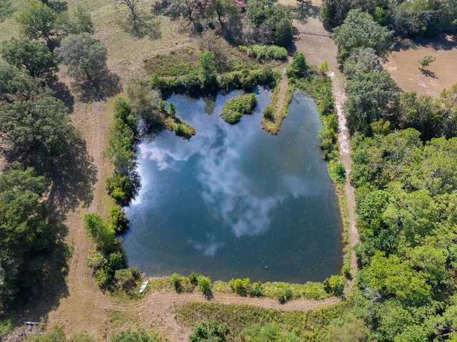 an aerial view of residential house with outdoor space
