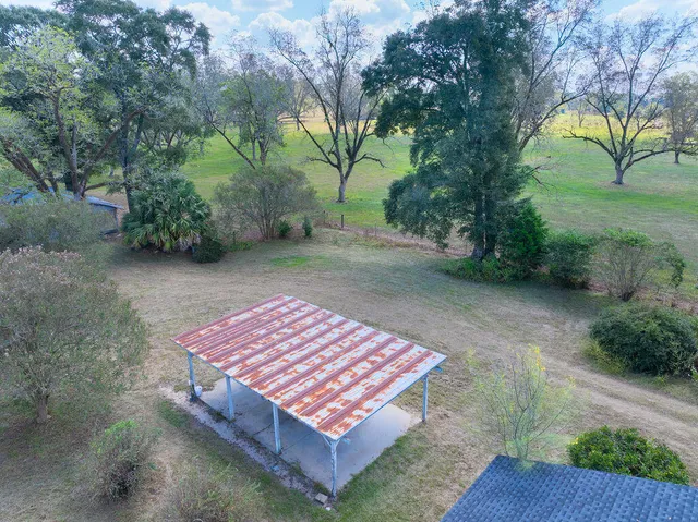 a backyard of a house with lots of green space
