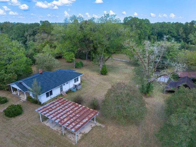 an aerial view of a house having yard