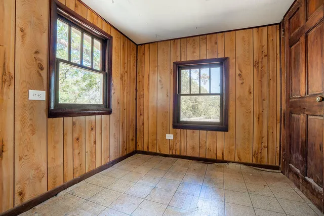 an empty room with windows