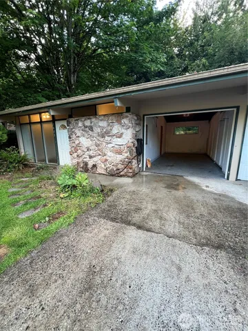 a view of backyard with roof and sink
