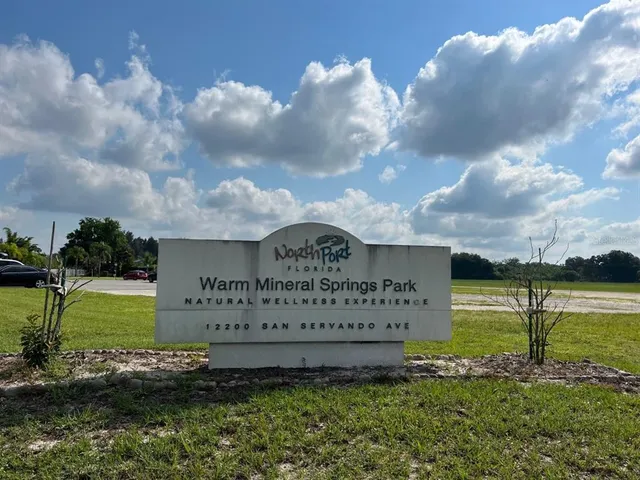 a view of a water with a building in the background
