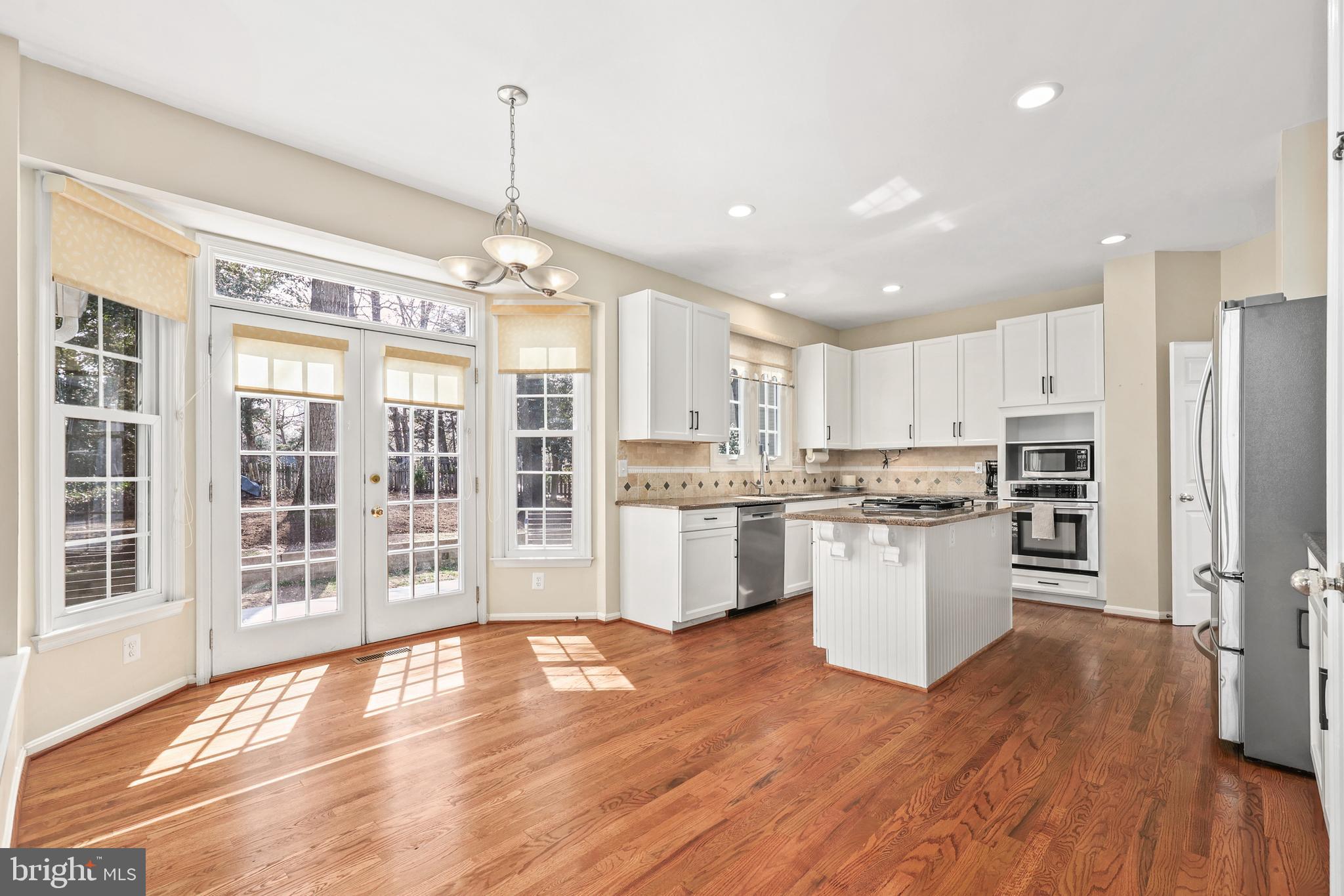 11405 Northwind Court Reston, VA 20194 - Photo 21 of 60 Open kitchen with table space and access to deck