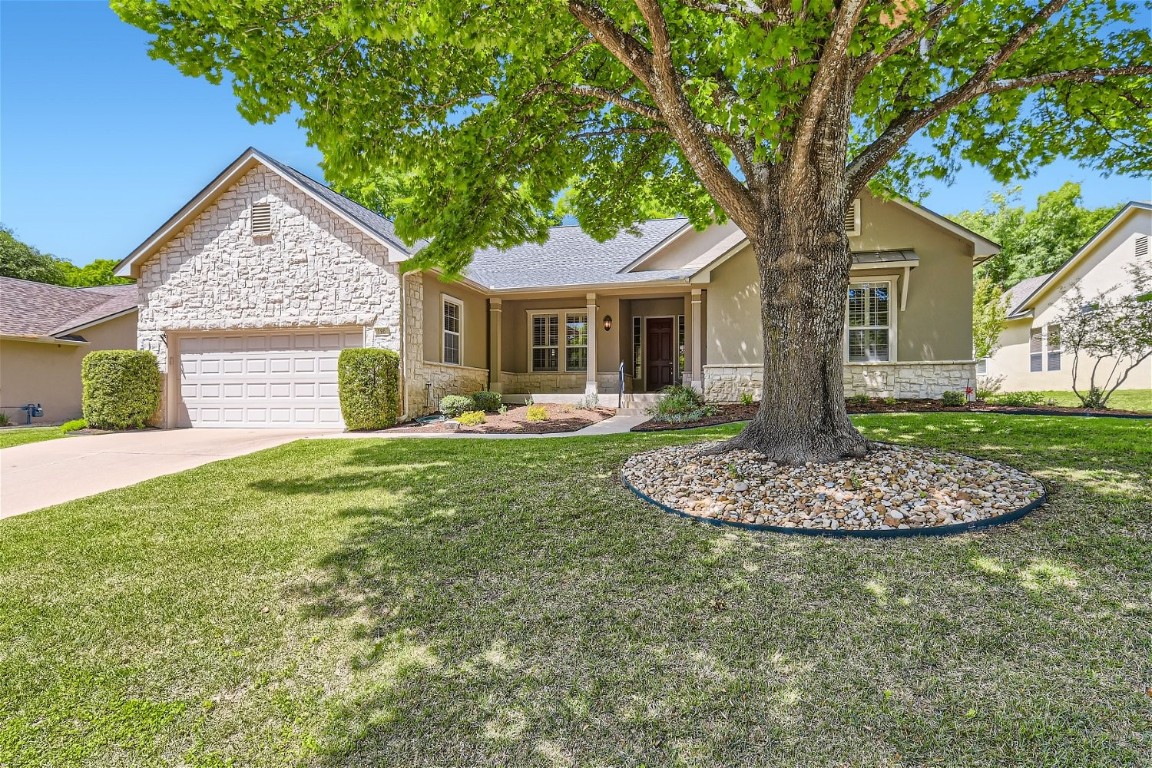 Fantastic curb appeal, Picture perfect tree and a true front porch to sit and visit on in this well cared for Home.