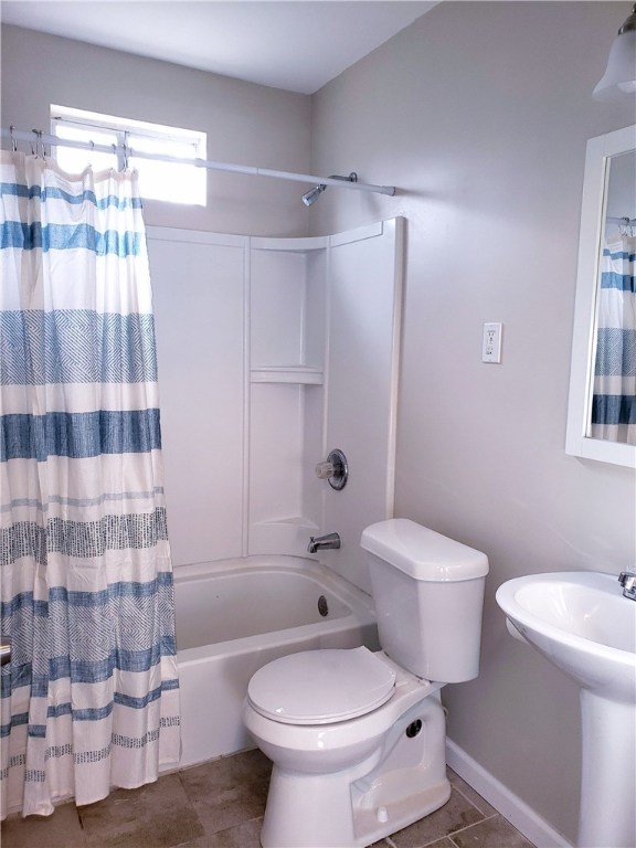 Undisclosed Address George West, TX 78022 - Photo 6 of 13 a white toilet sitting next to a bathroom sink and a shower