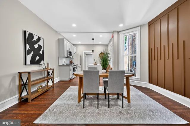 a dining room with furniture and window