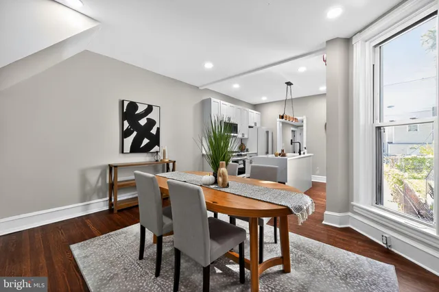 a dining room with furniture and window