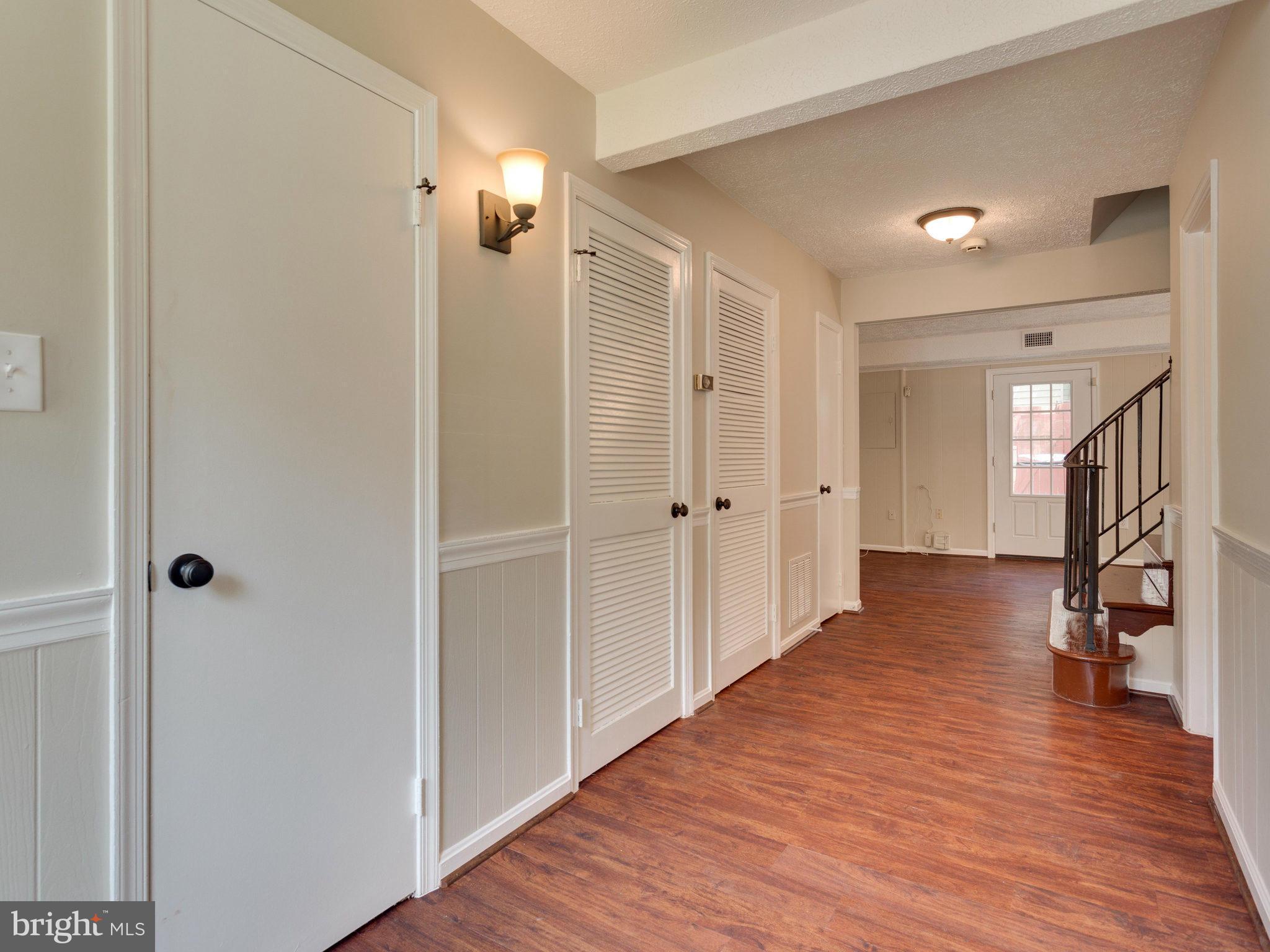 13133 Putnam Circle Woodbridge, VA 22191 - Photo 2 of 30 a view of a hallway with wooden floor