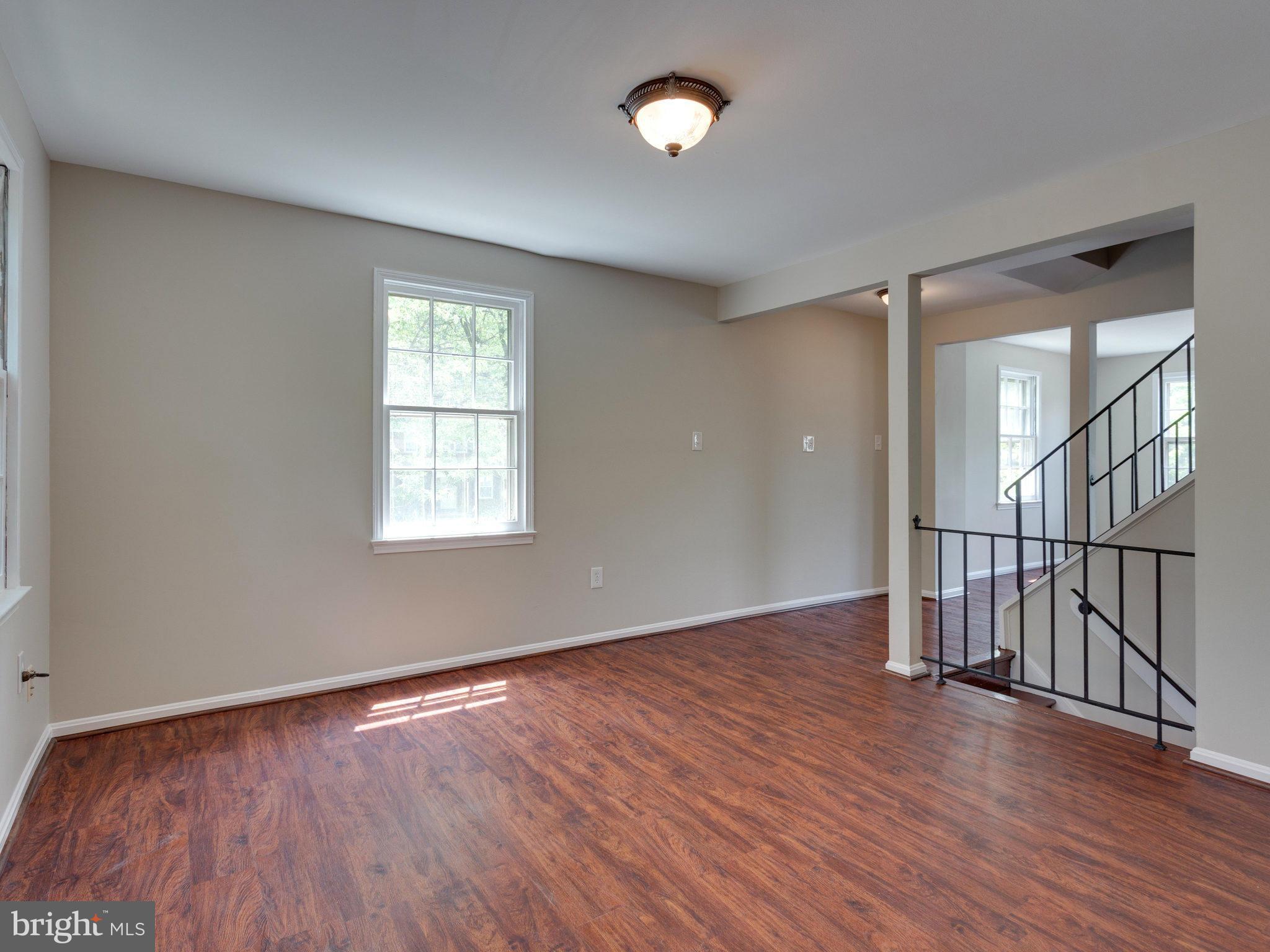 13133 Putnam Circle Woodbridge, VA 22191 - Photo 11 of 30 wooden floor in an empty room with a window