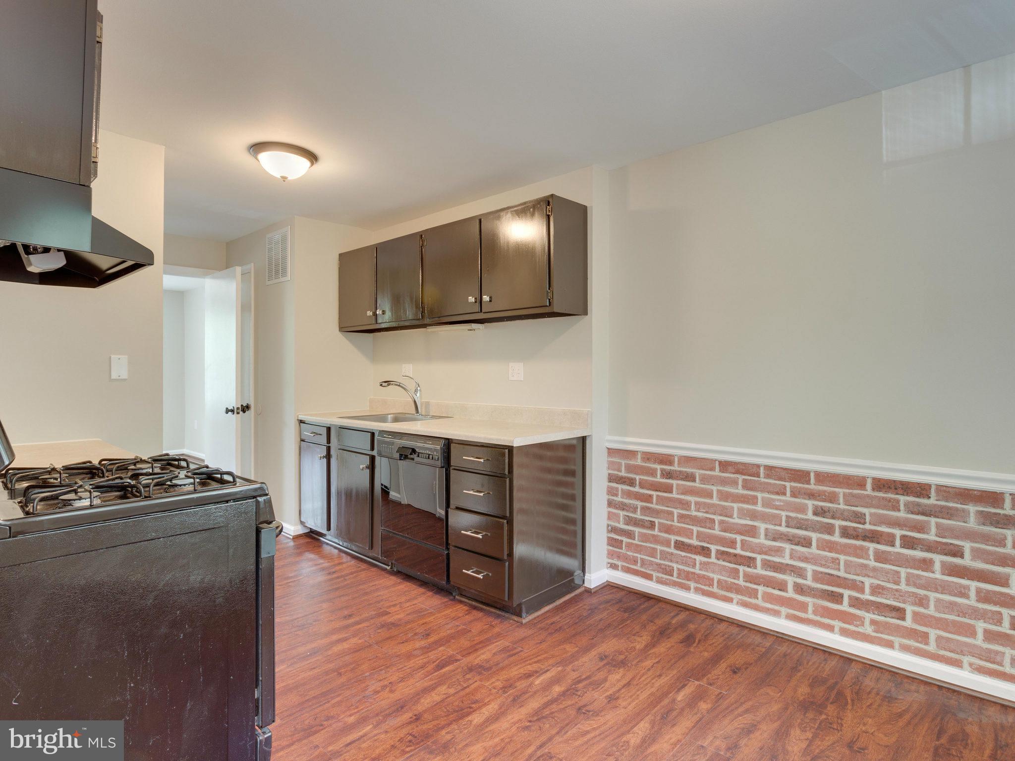13133 Putnam Circle Woodbridge, VA 22191 - Photo 12 of 30 a kitchen with stainless steel appliances a stove and a microwave