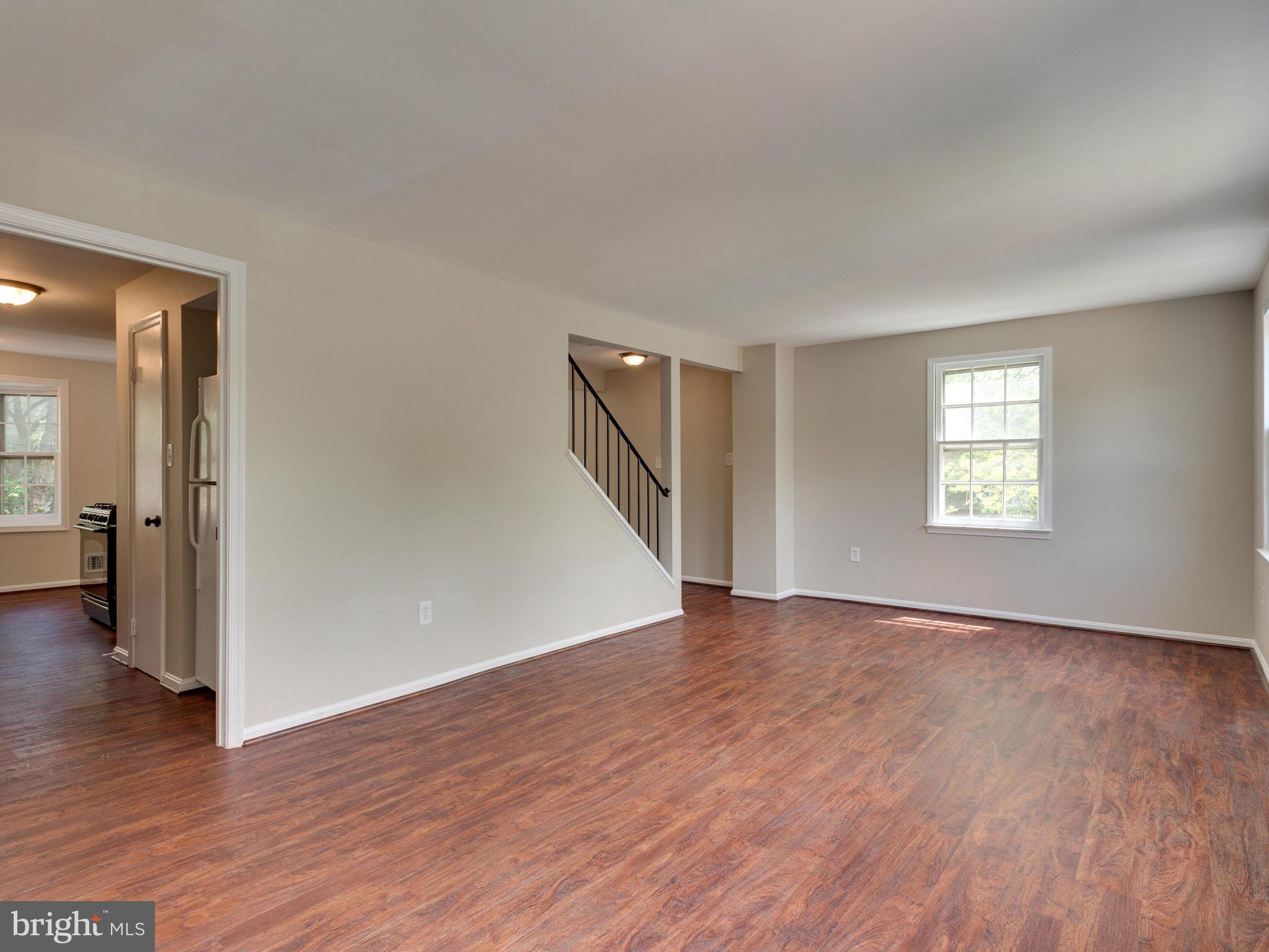 13133 Putnam Circle Woodbridge, VA 22191 - Photo 16 of 30 a view of an empty room with wooden floor and a window