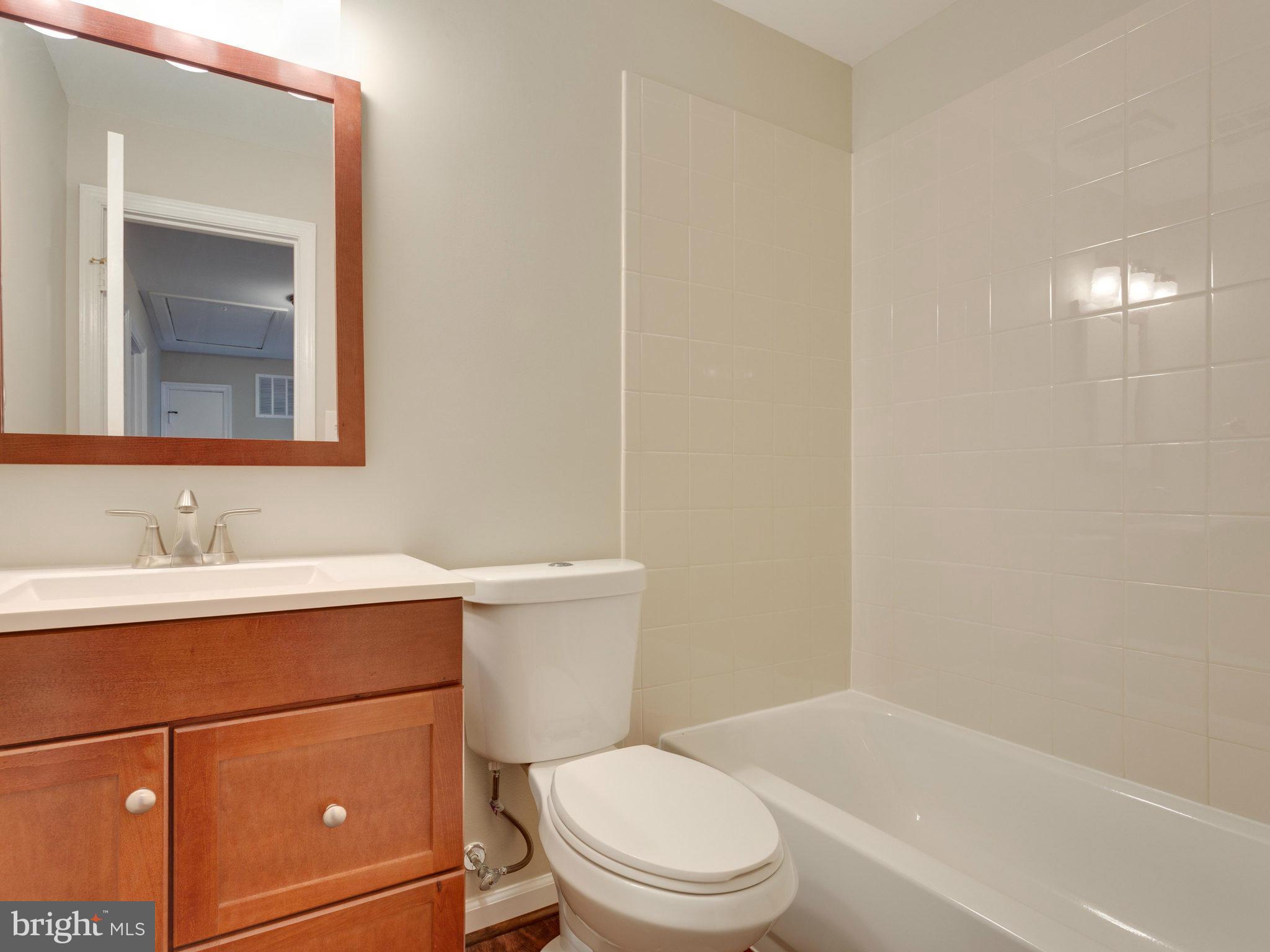 13133 Putnam Circle Woodbridge, VA 22191 - Photo 19 of 30 a bathroom with a sink a toilet and shower
