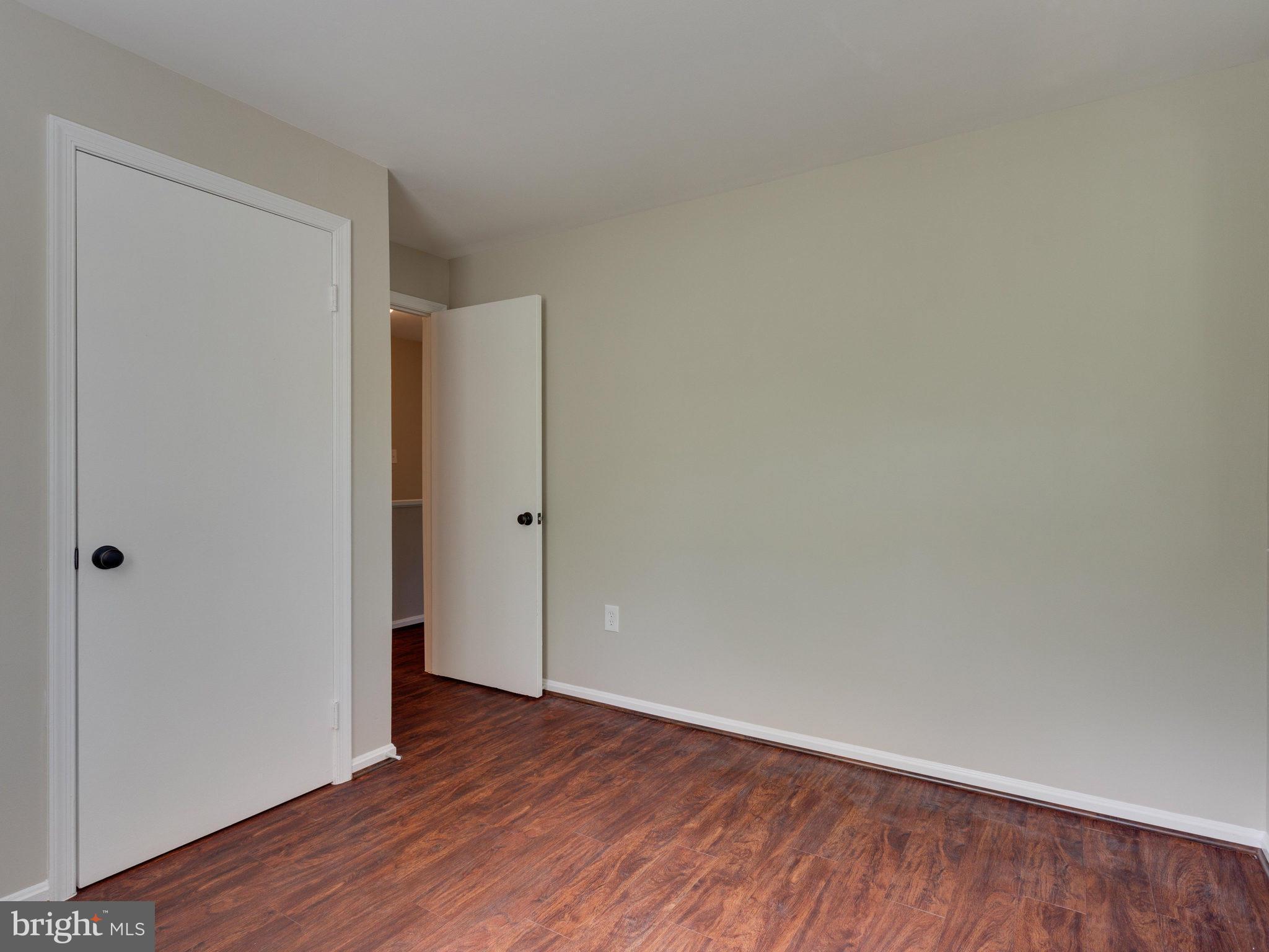 13133 Putnam Circle Woodbridge, VA 22191 - Photo 21 of 30 a view of an empty room with wooden floor