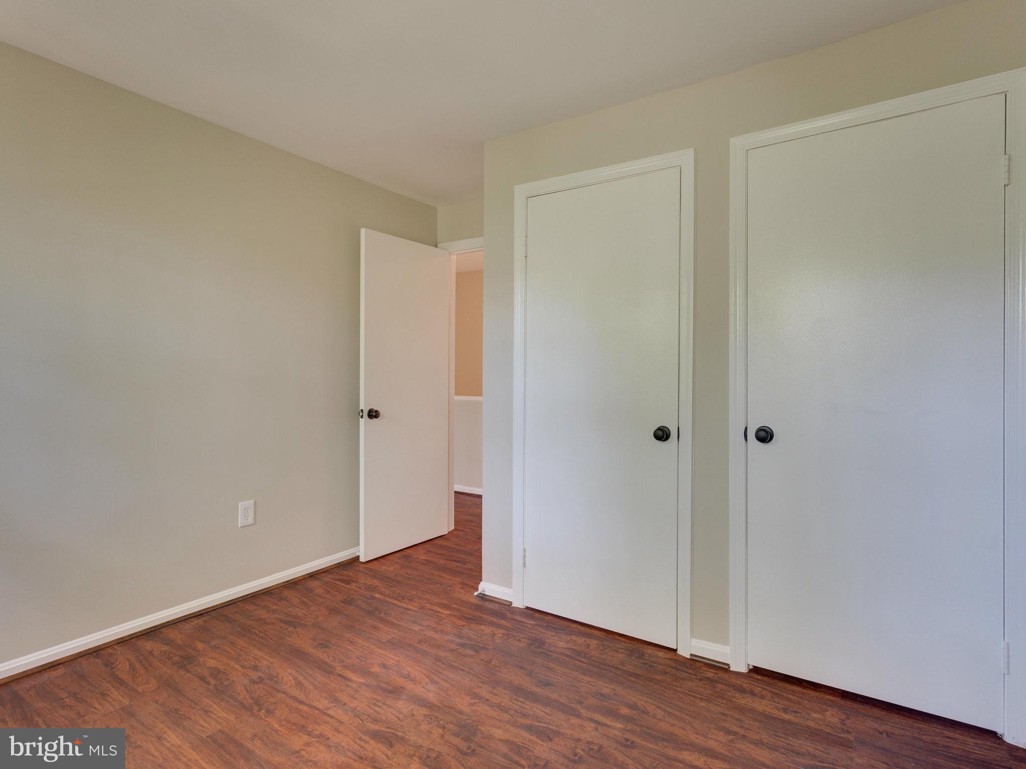 13133 Putnam Circle Woodbridge, VA 22191 - Photo 23 of 30 a view of an empty room with wooden floor