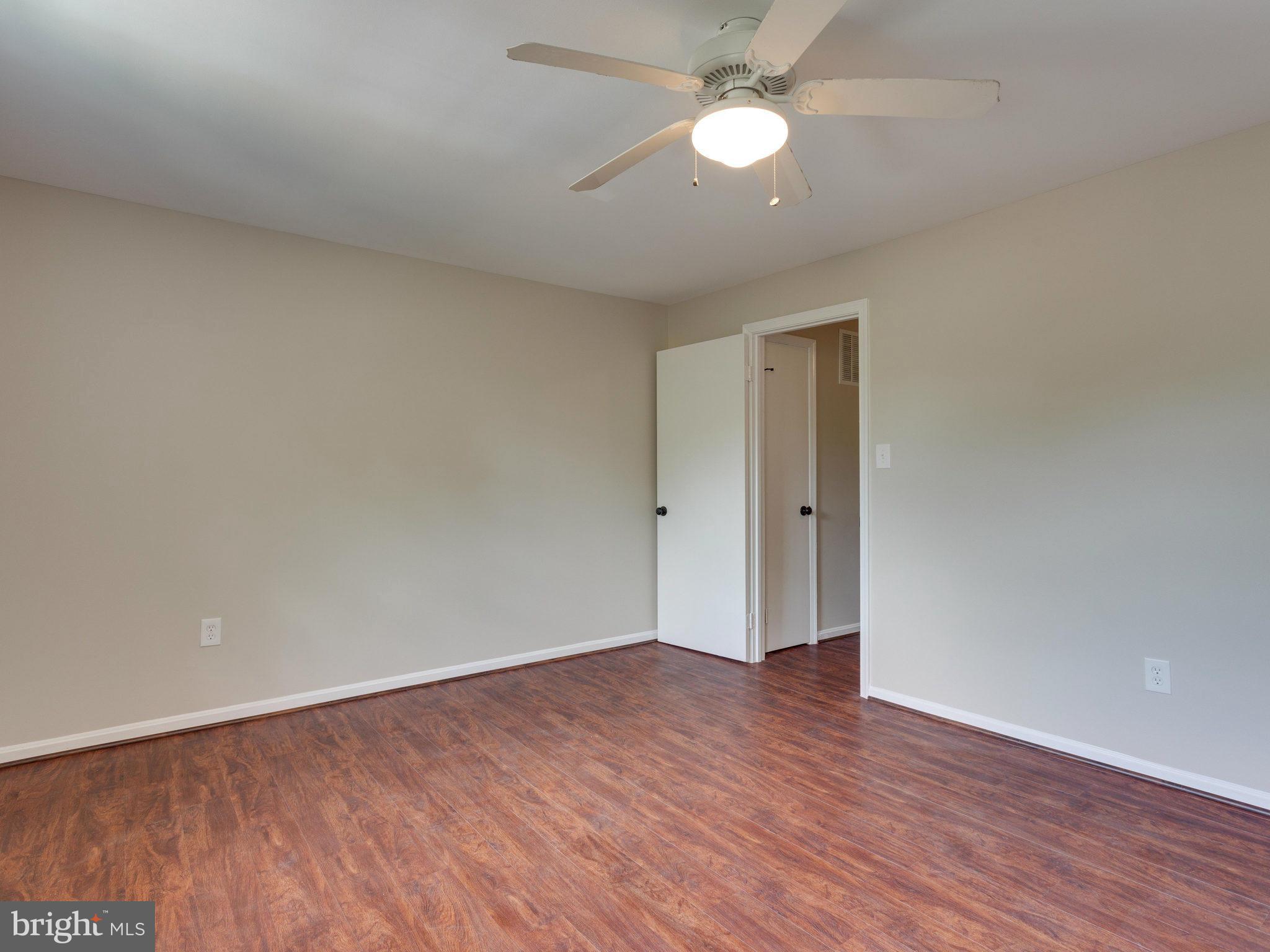 13133 Putnam Circle Woodbridge, VA 22191 - Photo 25 of 30 a view of an empty room with wooden floor