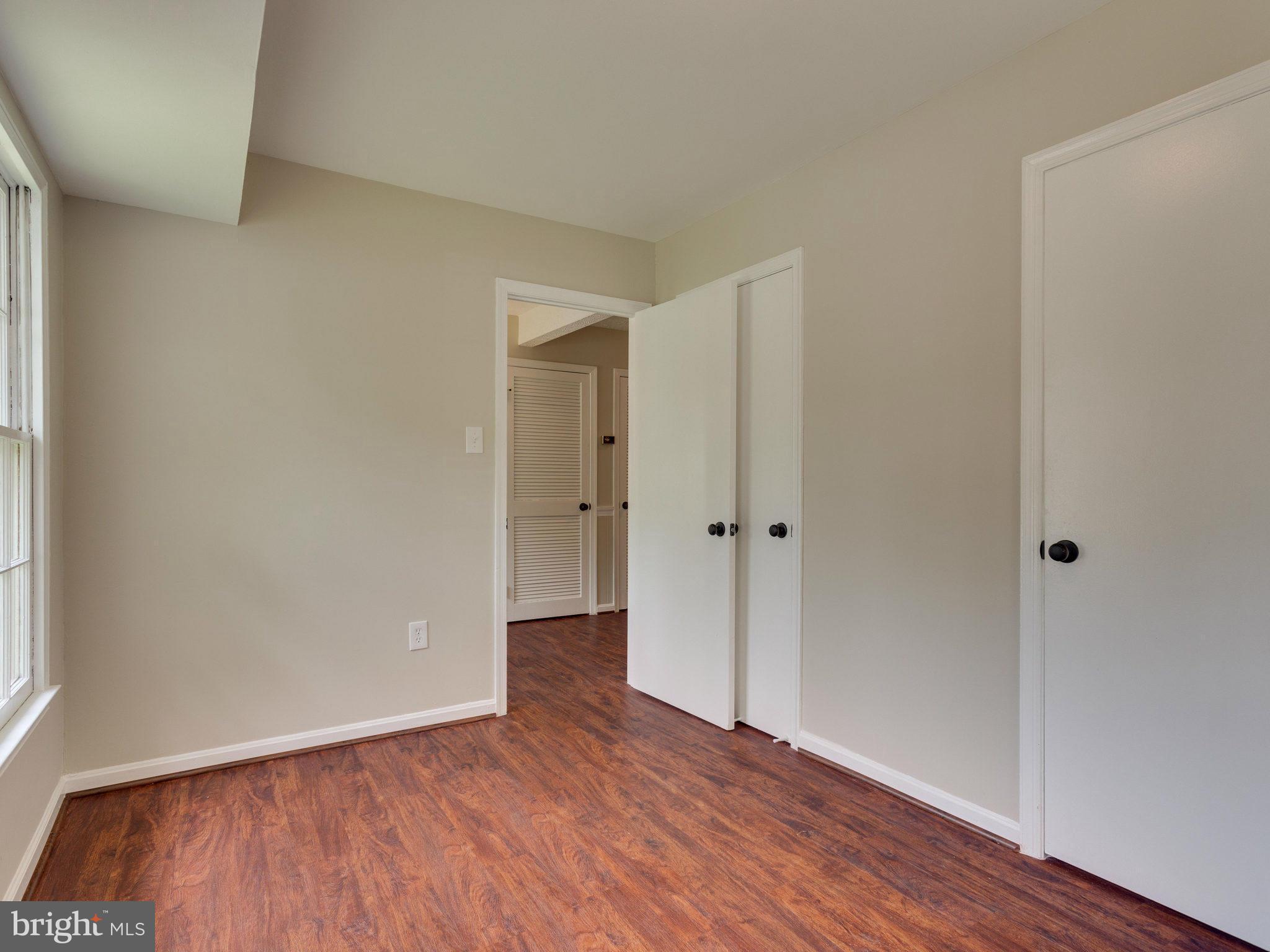 13133 Putnam Circle Woodbridge, VA 22191 - Photo 4 of 30 a view of an empty room and wooden floor