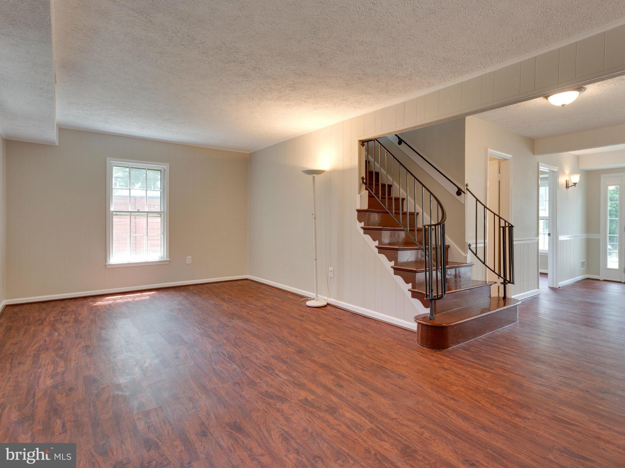 13133 Putnam Circle Woodbridge, VA 22191 - Photo 8 of 30 a view of entryway with wooden floor and stairs