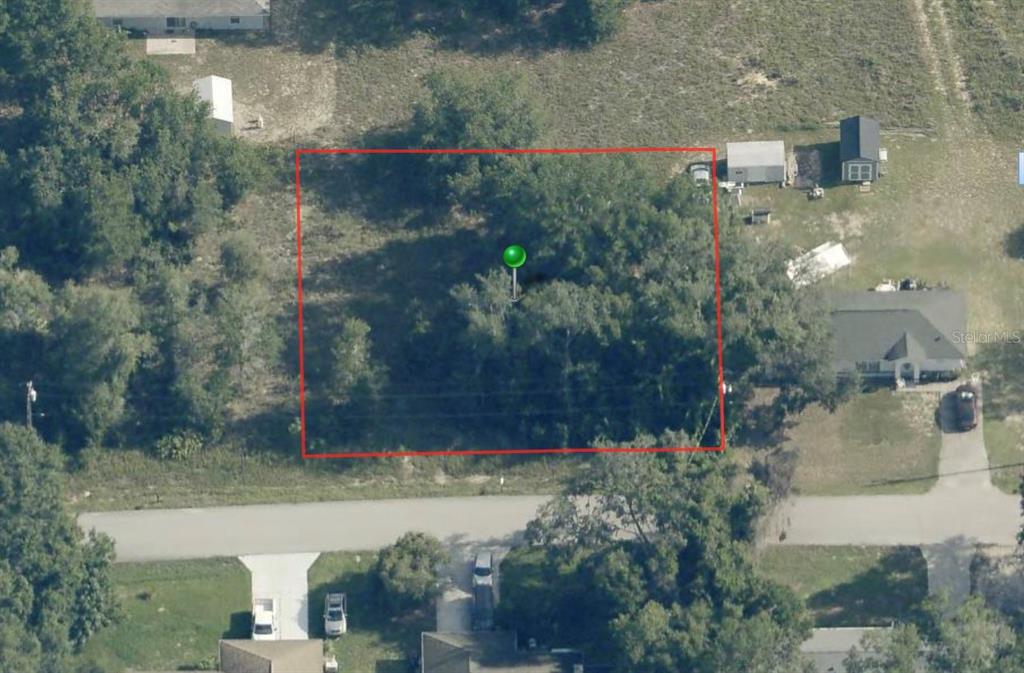 3943 East Scotty Street Inverness, FL 34453 - Photo 2 of 3 an aerial view of a house with a yard