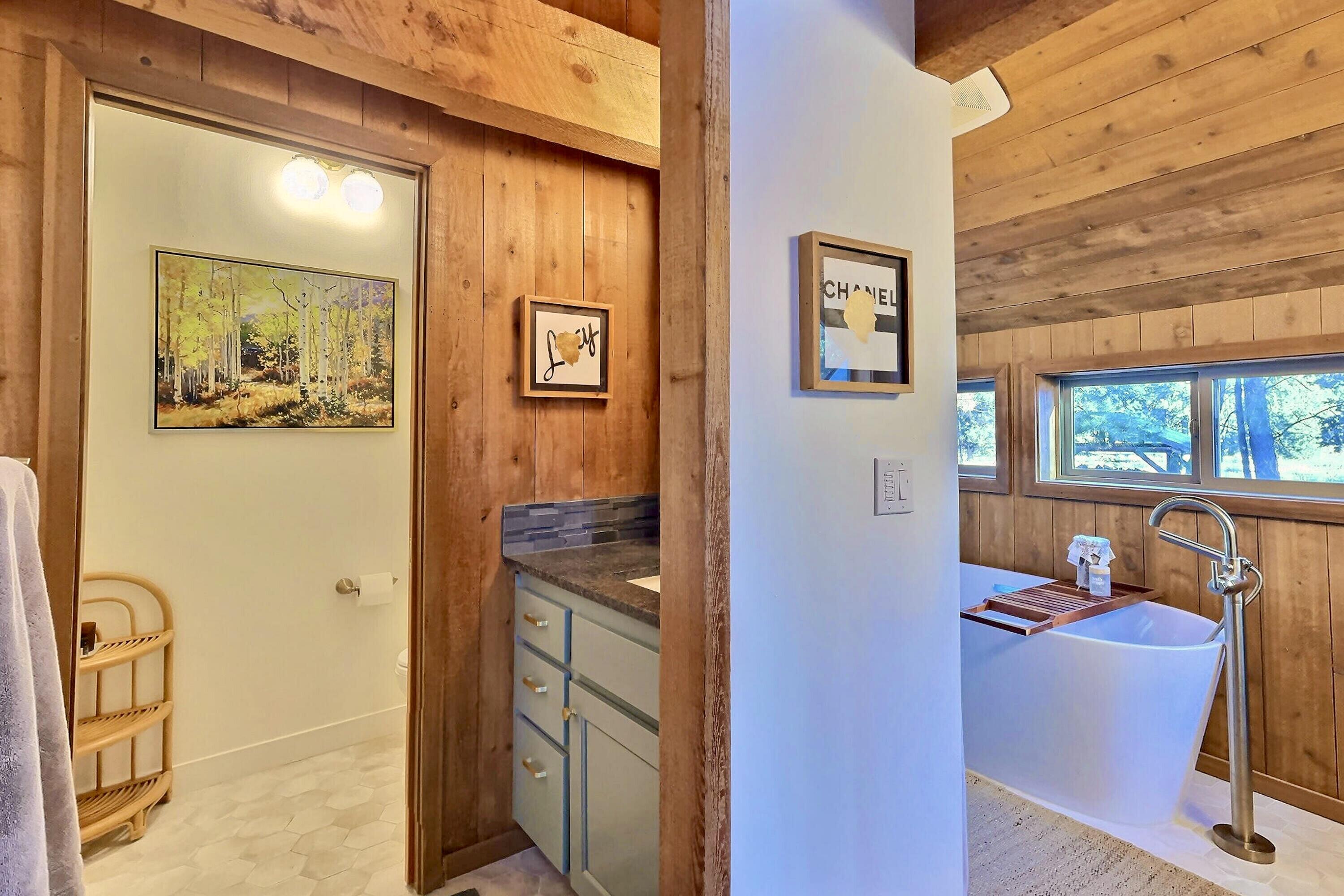 60359 Arnold Market Road Bend, OR 97702 - Photo 42 of 64 primary bath: separate toilet room with pocket door and his / hers vanities