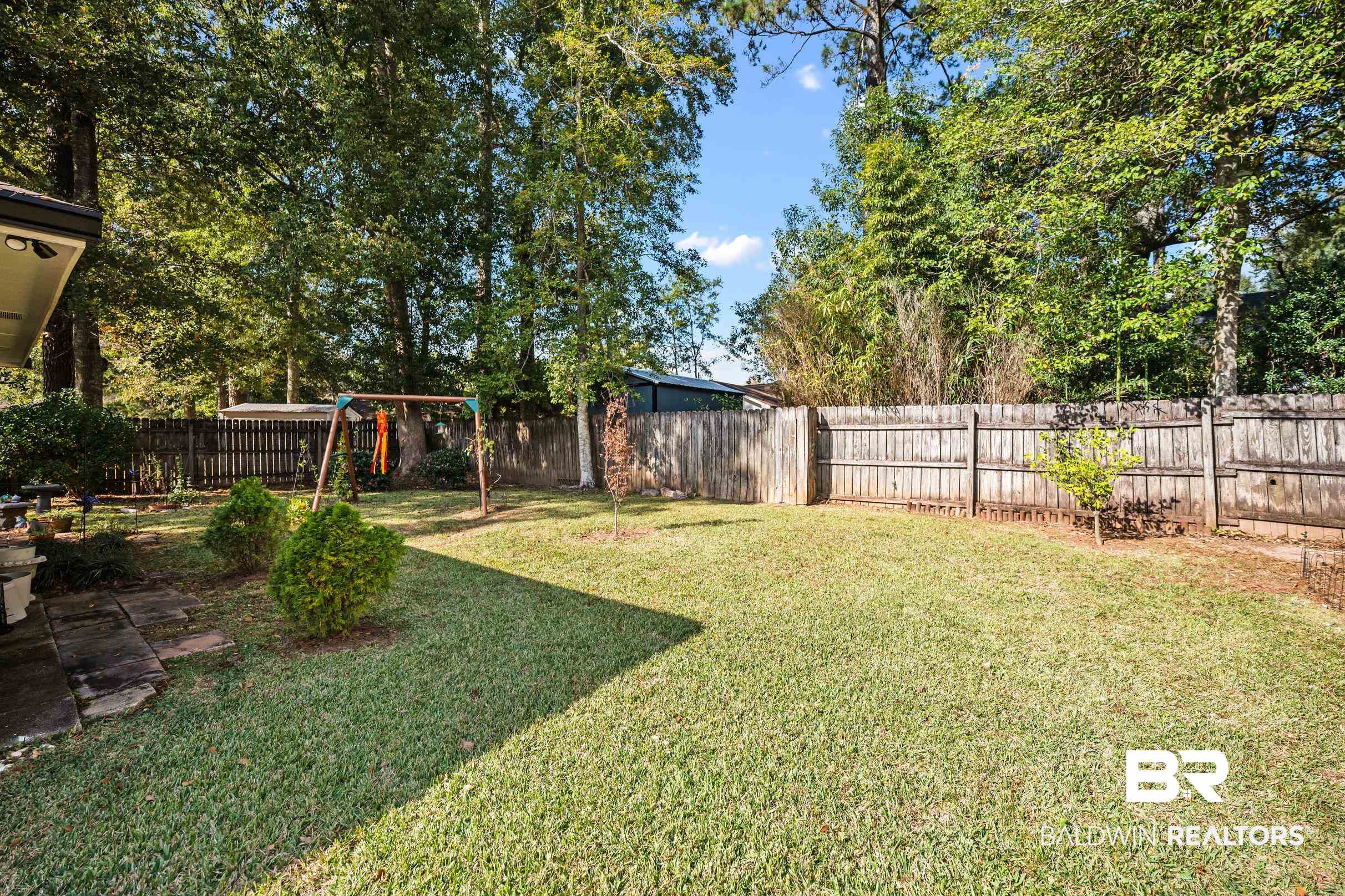 123 Dunbar Loop Daphne, AL 36526 - Photo 31 of 33 Fenced backyard with a playground