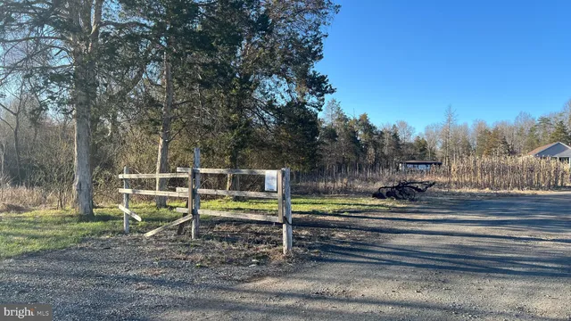 a backyard of a house with wooden stairs