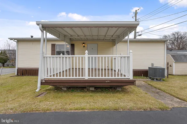 a view of a house with swimming pool in front of it