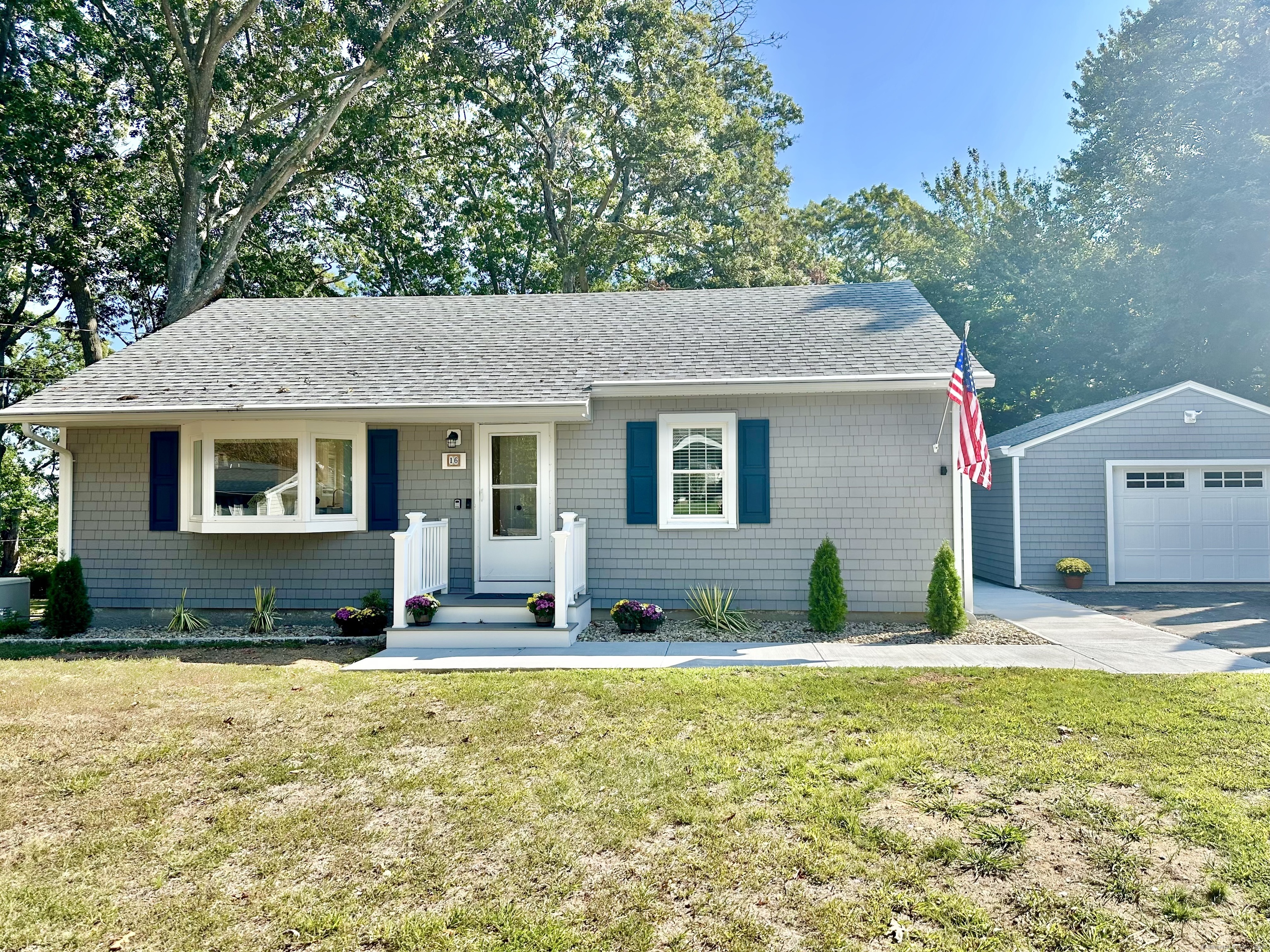 a front view of house with yard outdoor seating and barbeque oven