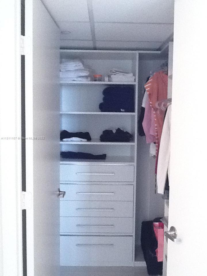 465 Brickell Avenue, Unit 3104 Miami, FL 33131 - Photo 12 of 21 a close view of walk in closet