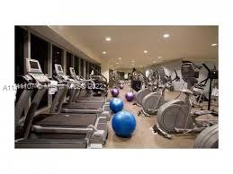465 Brickell Avenue, Unit 3104 Miami, FL 33131 - Photo 6 of 21 a room with lots of gym equipment