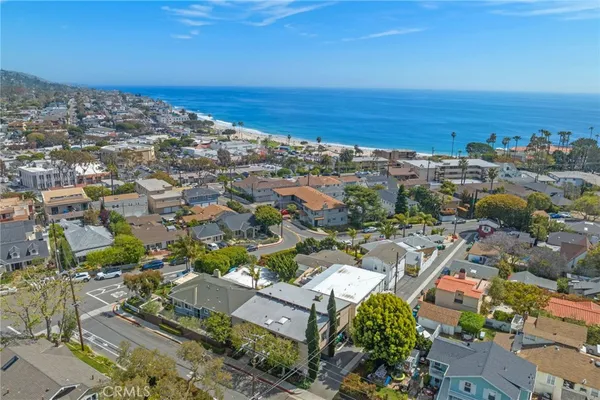 an aerial view of residential building and ocean