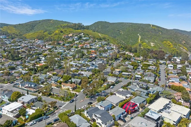 a view of a city with mountains in the background