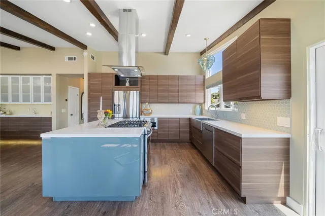 a kitchen with sink cabinets and wooden floor