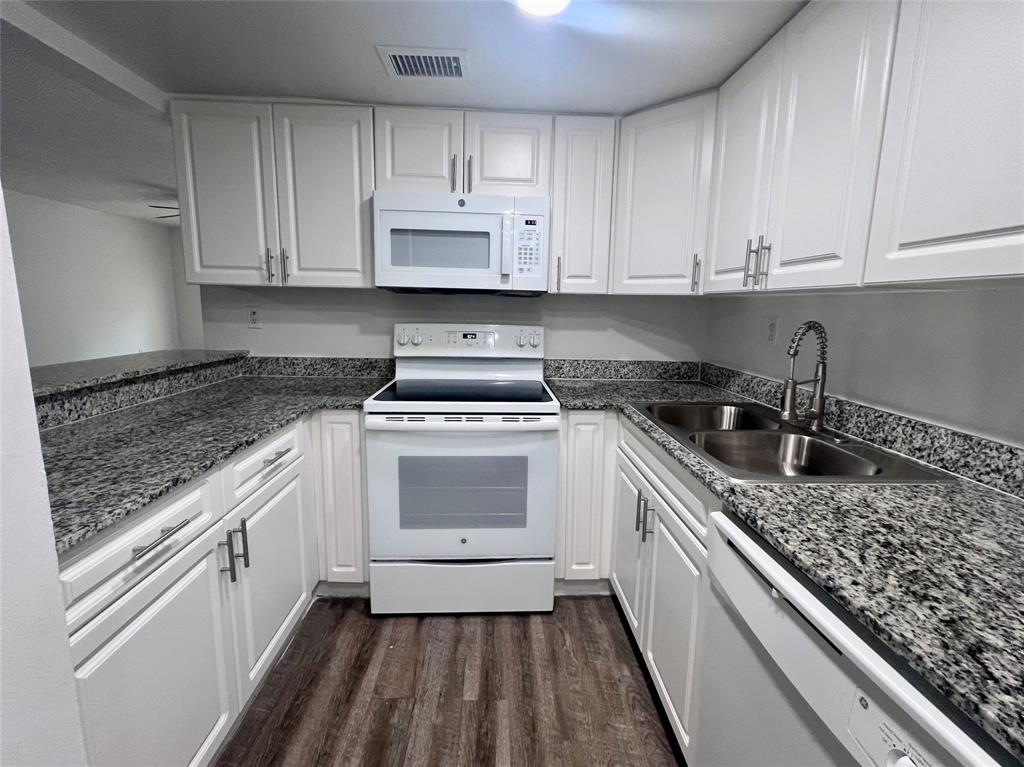 17350 Northwest 68th Avenue, Unit 400416 Hialeah, FL 33015 - Photo 1 of 16 a kitchen with a sink stove and cabinets