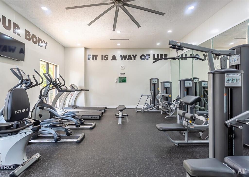 17350 Northwest 68th Avenue, Unit 400416 Hialeah, FL 33015 - Photo 12 of 16 a view of a room with gym equipment