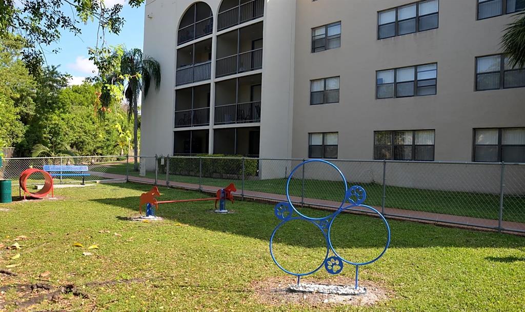 17350 Northwest 68th Avenue, Unit 400416 Hialeah, FL 33015 - Photo 15 of 16 a view of pool with a backyard