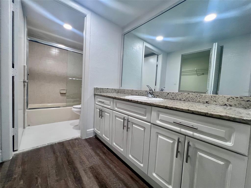 17350 Northwest 68th Avenue, Unit 400416 Hialeah, FL 33015 - Photo 6 of 16 a bathroom with a sink and a mirror