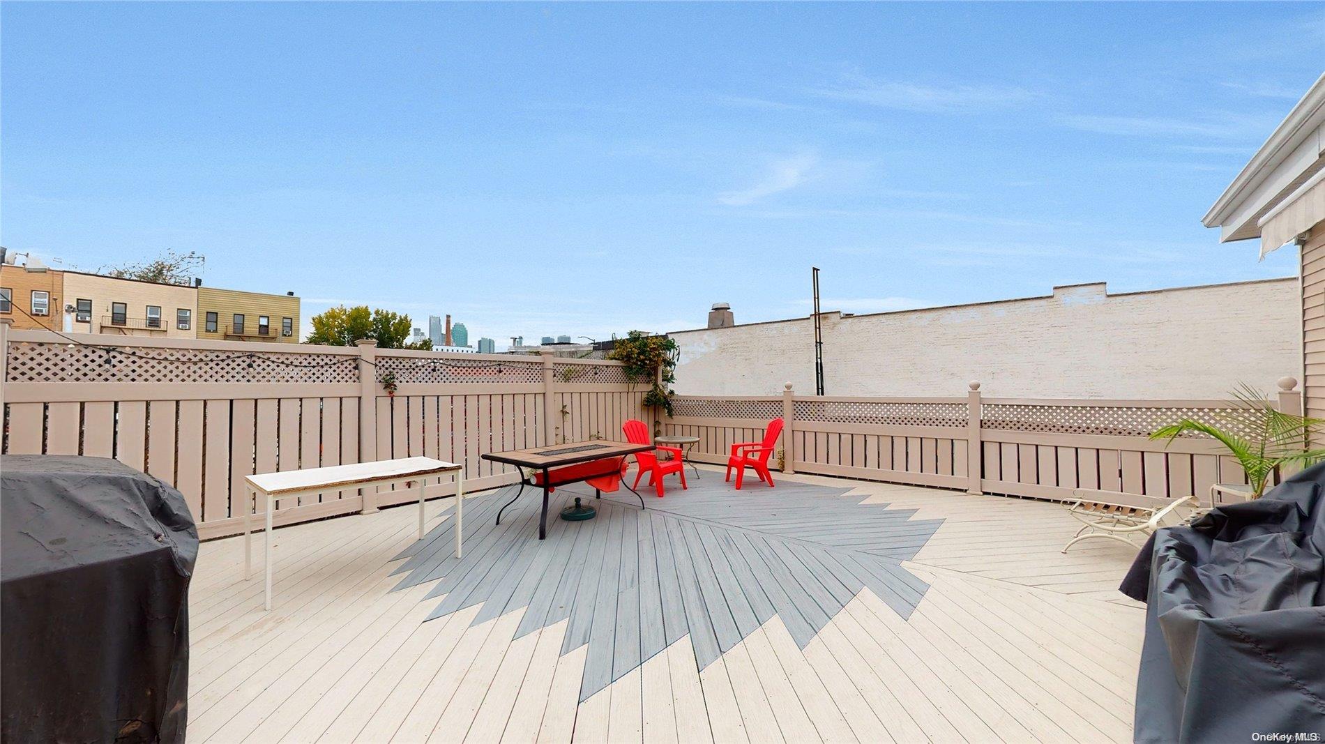 217 Java Street Brooklyn, NY 11222 - Photo 14 of 16 a balcony with wooden floor table and chairs