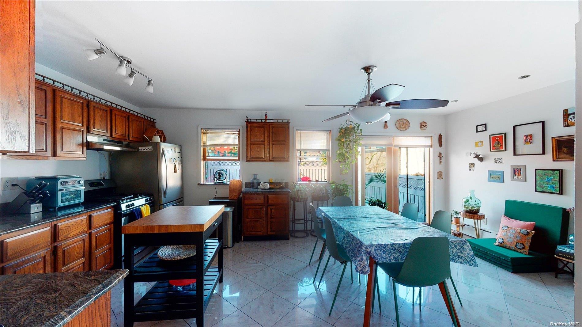 217 Java Street Brooklyn, NY 11222 - Photo 5 of 16 a living room with furniture a fireplace and a dining table with wooden floor