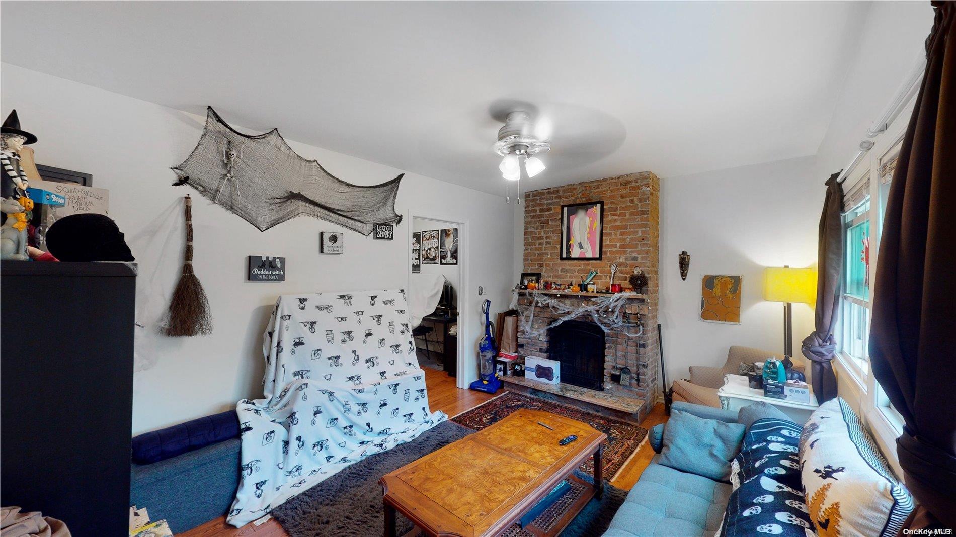 217 Java Street Brooklyn, NY 11222 - Photo 9 of 16 a living room with furniture and a fireplace