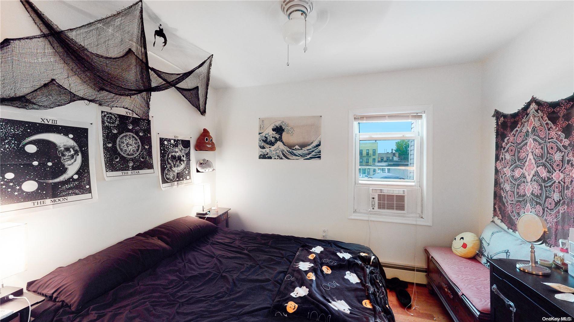 217 Java Street Brooklyn, NY 11222 - Photo 10 of 16 a bedroom with furniture and a window