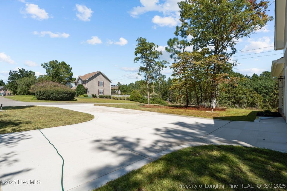 1420 Burning Tree Road Pinehurst, NC 28374 - Photo 50 of 50 a view of yard with swimming pool and yard